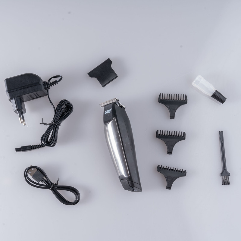 ماشین اصلاح موی سر و صورت شارژی جی دبلیو مدل G-9819، اصلاح به صورت خط زن و صفر زن، منبع انرژی با برق و باتری، تکنولوژی اصلاح به صورت تریمر، اندازه اصلاح 0.1 میلیمتر، مدت زمان شارژ 480 دقیقه و مدت زمان استفاده پس از شارژ 60 دقیقه، به همراه شارژر و روغن